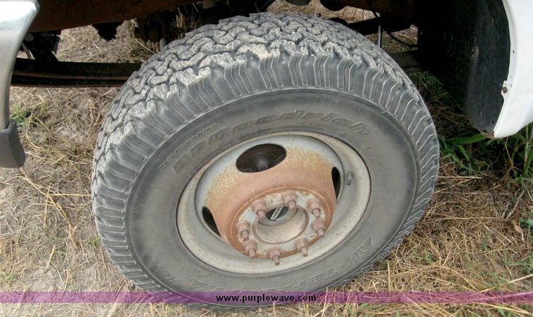 image for item 8719 1999 Ford F350 super duty pickup truck with utility bed