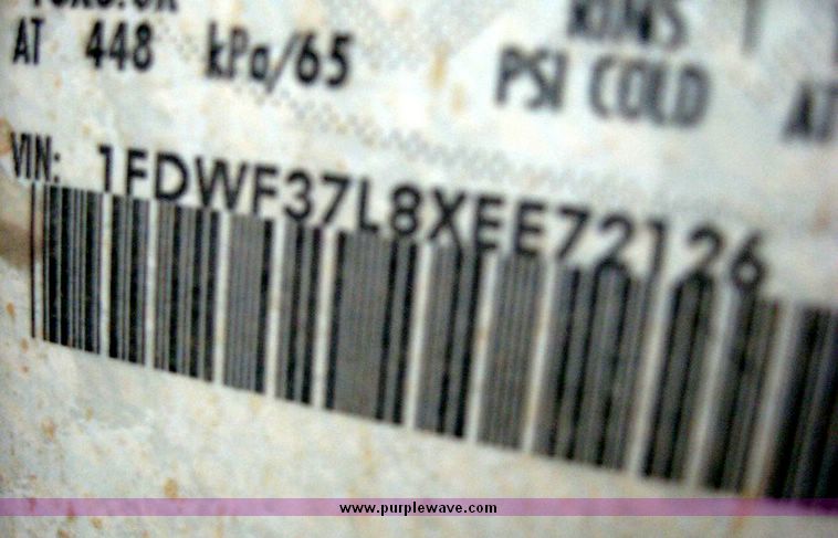 image for item 8719 1999 Ford F350 super duty pickup truck with utility bed