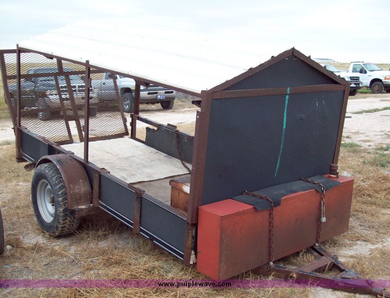 image for item 8741 10' single axle utility trailer with fold down ramp and roof