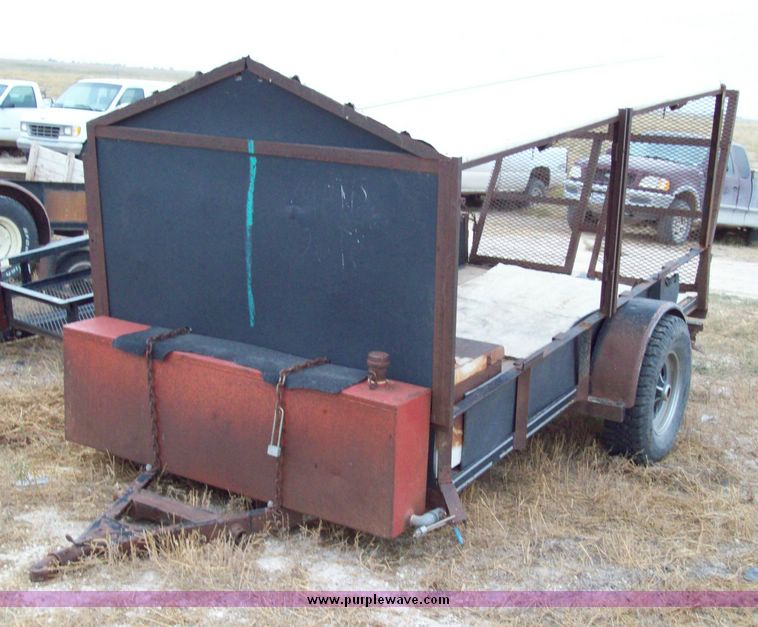 image for item 8741 10' single axle utility trailer with fold down ramp and roof