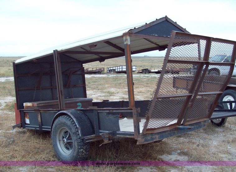 image for item 8741 10' single axle utility trailer with fold down ramp and roof