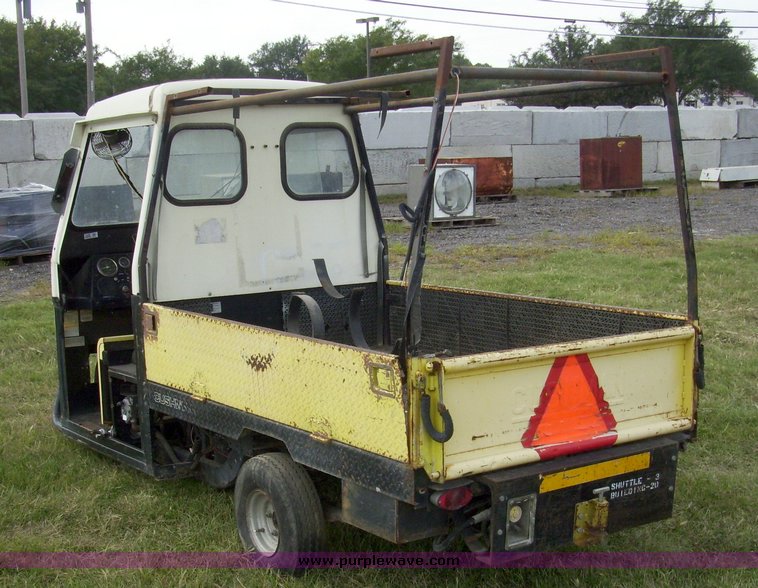image for item 7326 Cushman three wheel full ton hauler