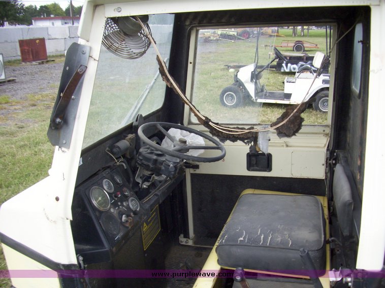 image for item 7326 Cushman three wheel full ton hauler