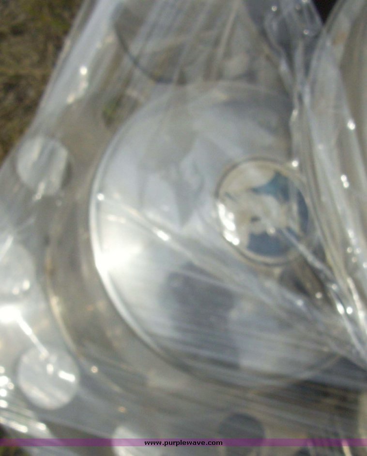 image for item 7347 (2) pallets of hubcaps and wheel centers