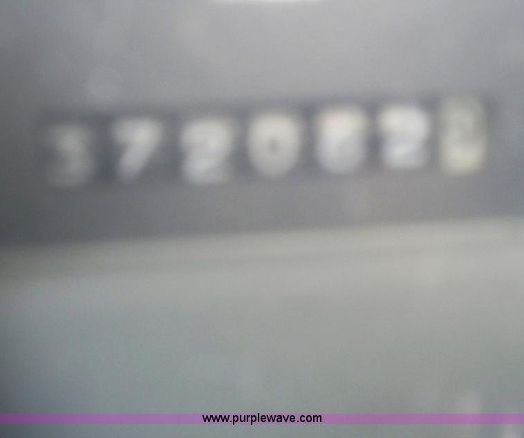 image for item 7399 1997 International 4700 rollback wrecker