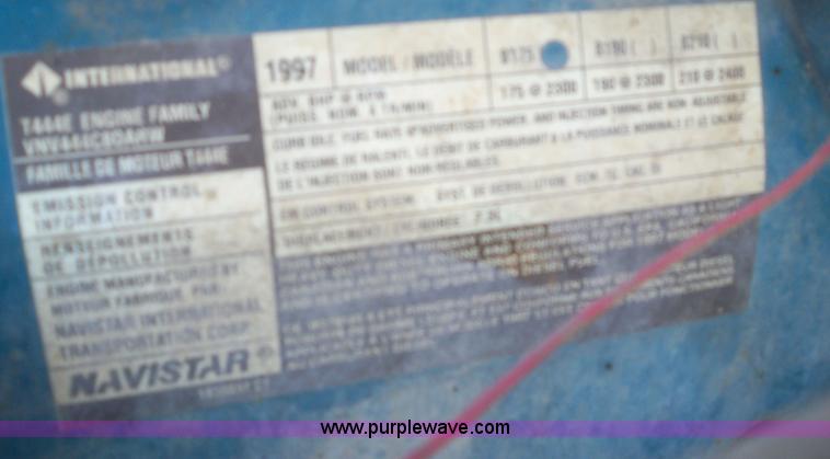 image for item 7399 1997 International 4700 rollback wrecker