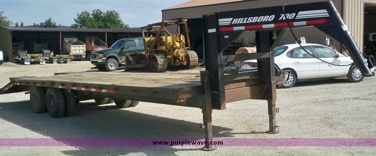 image for item 7404 2001 Hillsboro 700 flatbed trailer with folding dovetail