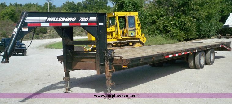 image for item 7404 2001 Hillsboro 700 flatbed trailer with folding dovetail