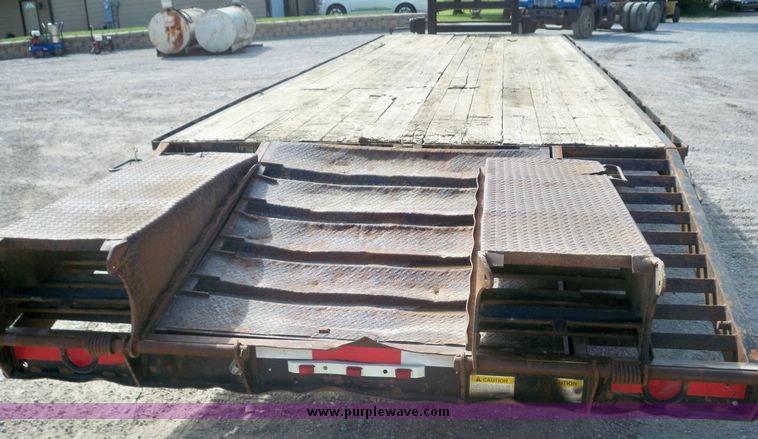 image for item 7404 2001 Hillsboro 700 flatbed trailer with folding dovetail
