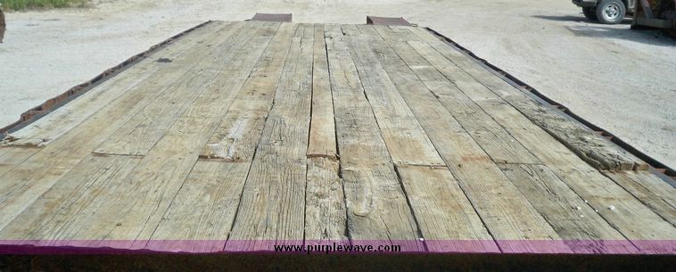 image for item 7404 2001 Hillsboro 700 flatbed trailer with folding dovetail