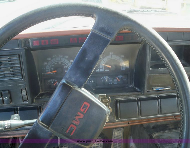 image for item 7411 1992 GMC Topkick truck with 12' flatbed