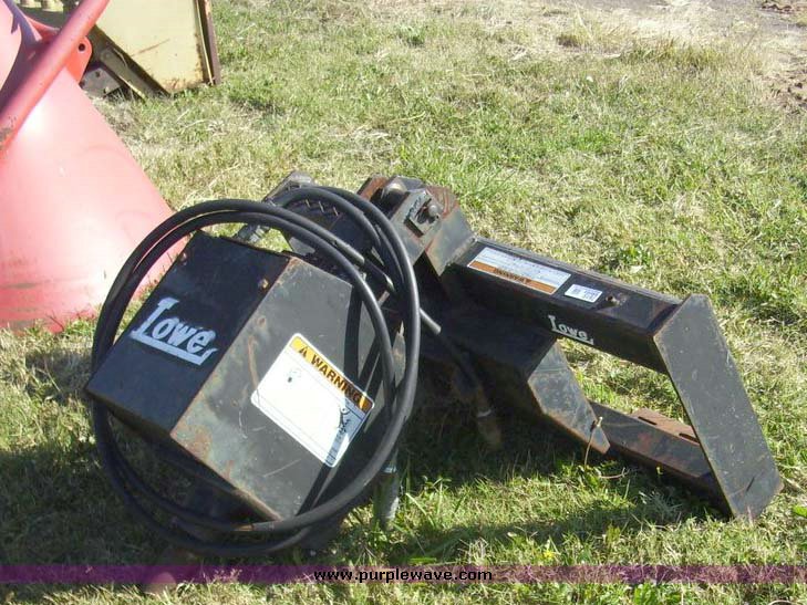 image for item 7619 Lowe hydraulic auger skid steer attachment