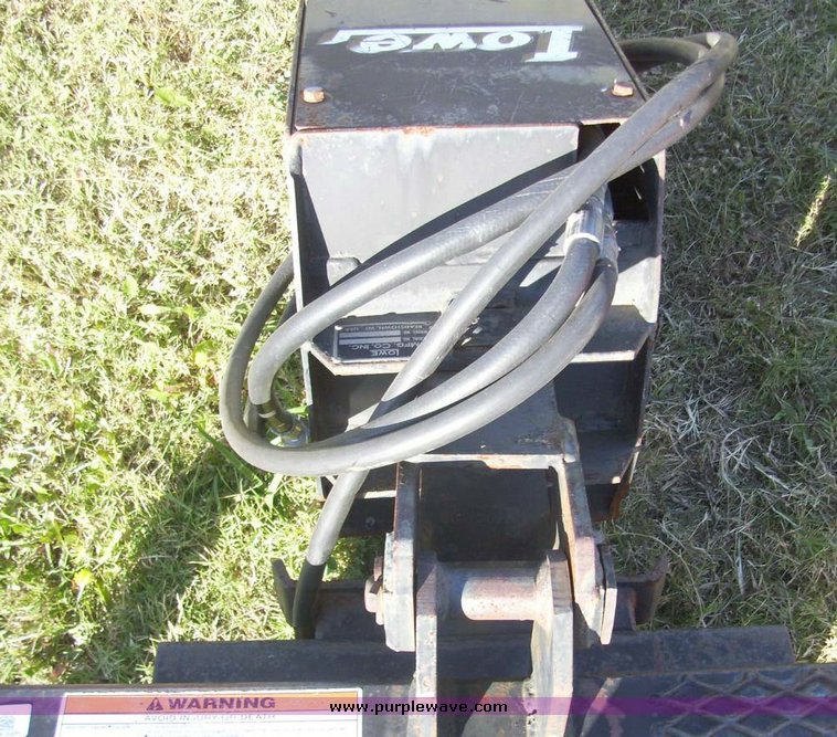 image for item 7619 Lowe hydraulic auger skid steer attachment