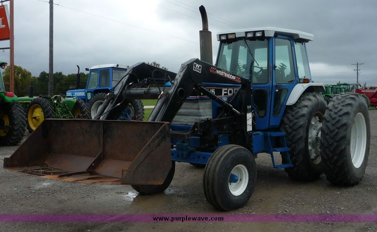 image for item 2063 1988 Ford TW15-2 tractor with Westendorf TA28 quick-attach loader