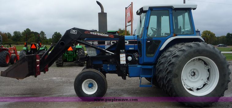 image for item 2063 1988 Ford TW15-2 tractor with Westendorf TA28 quick-attach loader