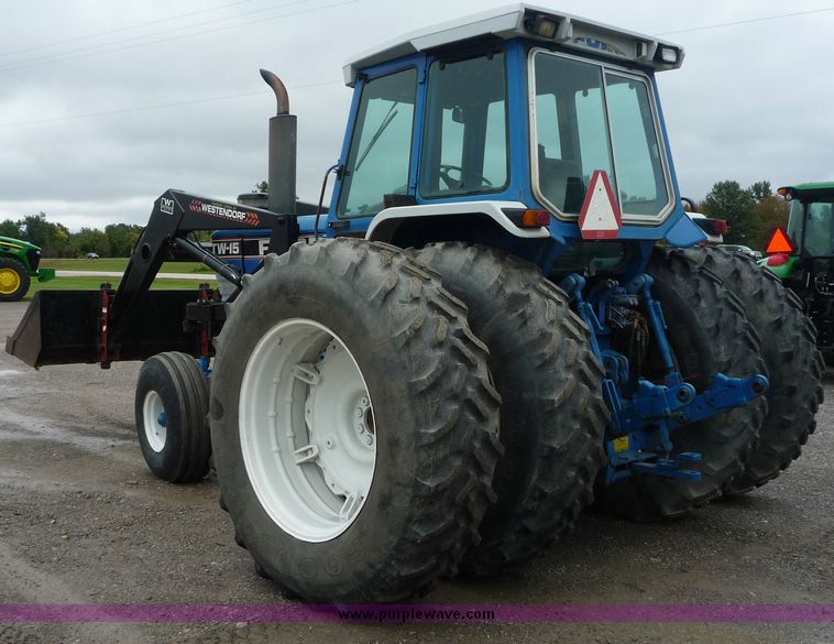 image for item 2063 1988 Ford TW15-2 tractor with Westendorf TA28 quick-attach loader