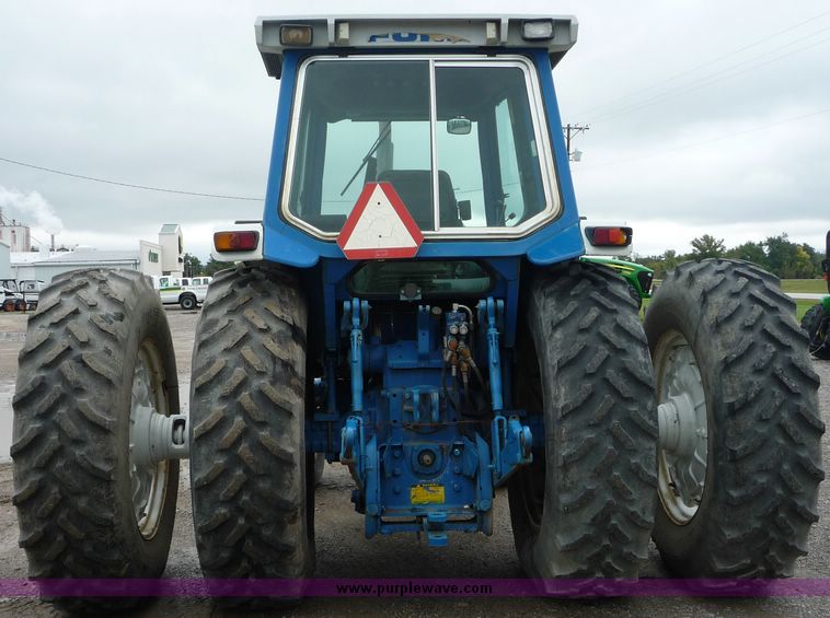 image for item 2063 1988 Ford TW15-2 tractor with Westendorf TA28 quick-attach loader