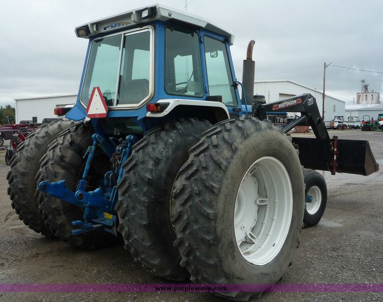 image for item 2063 1988 Ford TW15-2 tractor with Westendorf TA28 quick-attach loader