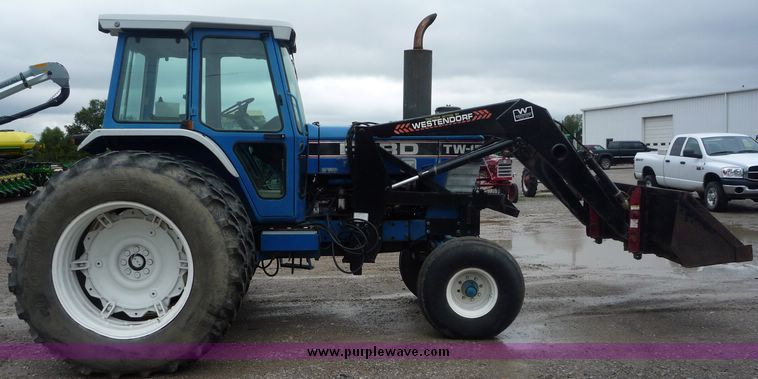 image for item 2063 1988 Ford TW15-2 tractor with Westendorf TA28 quick-attach loader