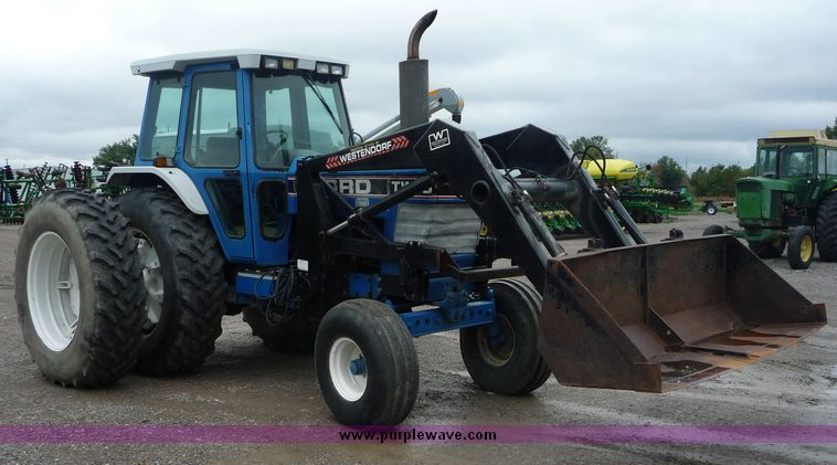 image for item 2063 1988 Ford TW15-2 tractor with Westendorf TA28 quick-attach loader