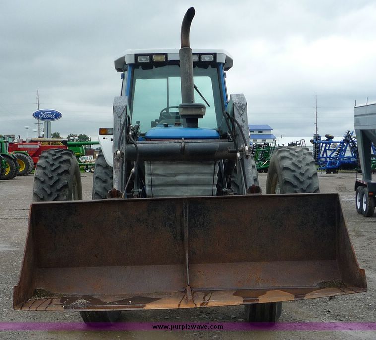 image for item 2063 1988 Ford TW15-2 tractor with Westendorf TA28 quick-attach loader