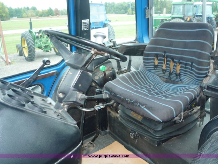 image for item 2063 1988 Ford TW15-2 tractor with Westendorf TA28 quick-attach loader