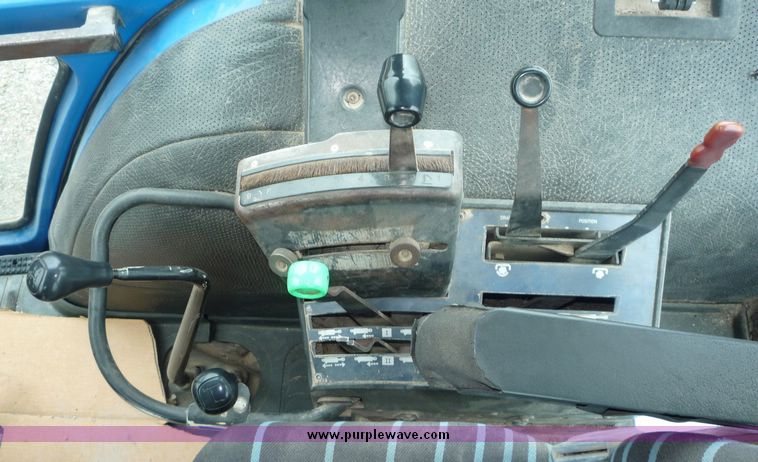 image for item 2063 1988 Ford TW15-2 tractor with Westendorf TA28 quick-attach loader