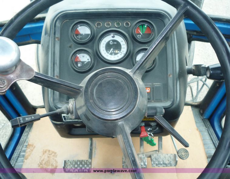 image for item 2063 1988 Ford TW15-2 tractor with Westendorf TA28 quick-attach loader