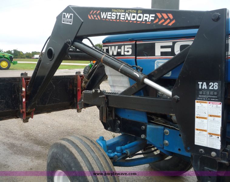 image for item 2063 1988 Ford TW15-2 tractor with Westendorf TA28 quick-attach loader