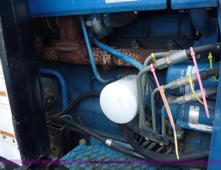 image for item 2063 1988 Ford TW15-2 tractor with Westendorf TA28 quick-attach loader