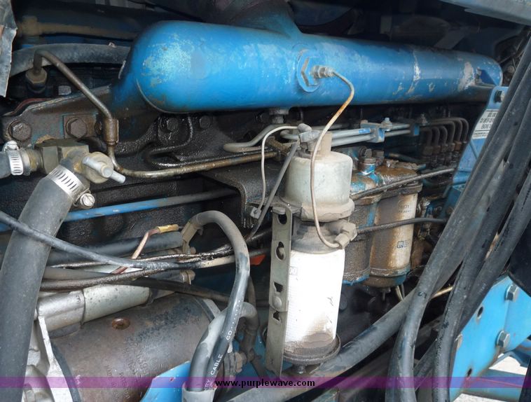 image for item 2063 1988 Ford TW15-2 tractor with Westendorf TA28 quick-attach loader