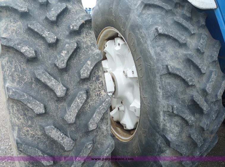 image for item 2063 1988 Ford TW15-2 tractor with Westendorf TA28 quick-attach loader