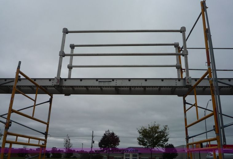 image for item 2219 (5) 24' x 24" scaffolding planks with guard rail