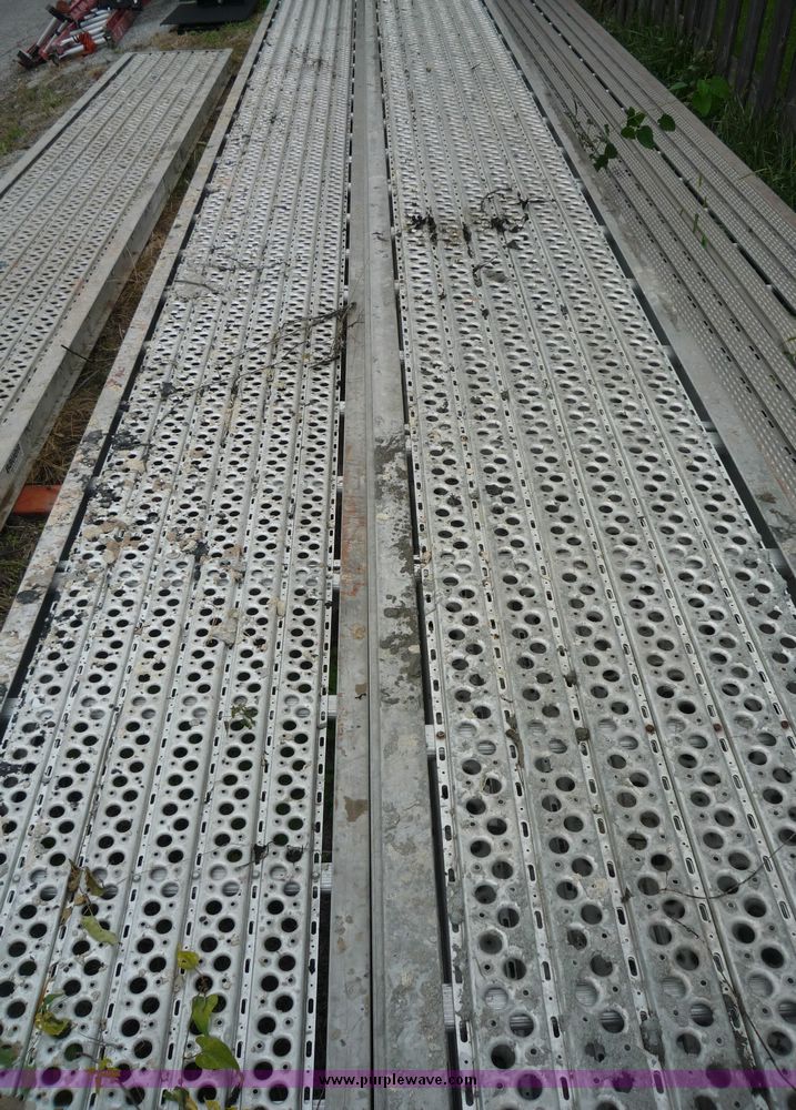 image for item 2219 (5) 24' x 24" scaffolding planks with guard rail