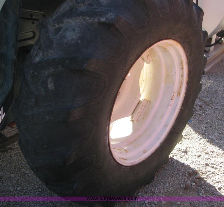 image for item 6555 1998 New Holland 6640SL wheel tractor