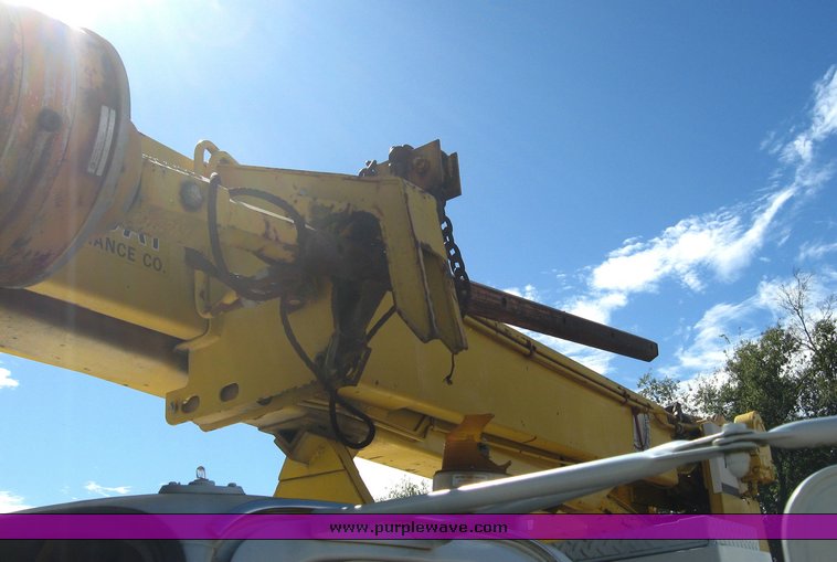 image for item 6722 1979 GMC truck with utility bed and Pitman Polecat 1500 boom arm with hydraulic driven auger and 18" bit