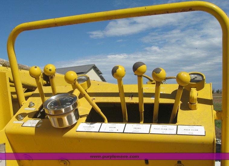 image for item 6722 1979 GMC truck with utility bed and Pitman Polecat 1500 boom arm with hydraulic driven auger and 18" bit