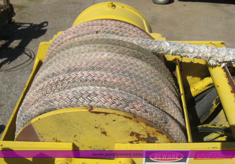 image for item 6722 1979 GMC truck with utility bed and Pitman Polecat 1500 boom arm with hydraulic driven auger and 18" bit