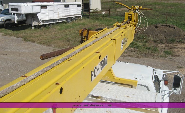 image for item 6722 1979 GMC truck with utility bed and Pitman Polecat 1500 boom arm with hydraulic driven auger and 18" bit