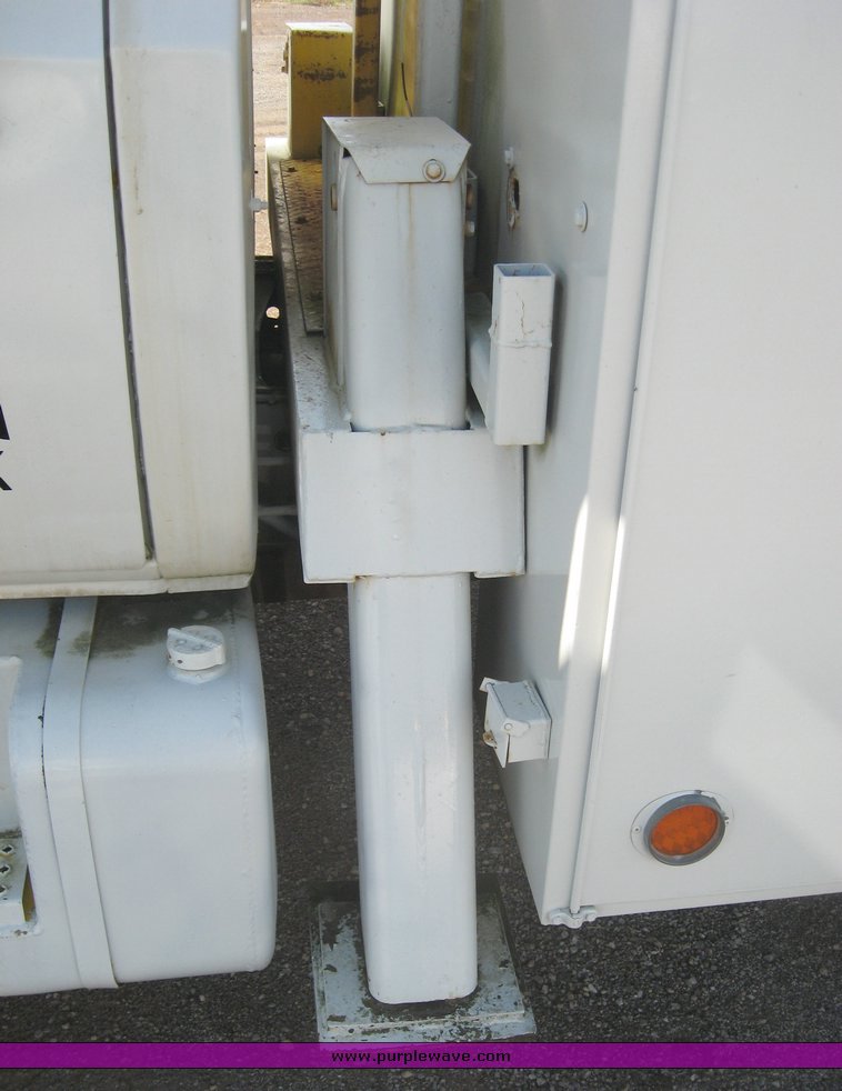 image for item 6722 1979 GMC truck with utility bed and Pitman Polecat 1500 boom arm with hydraulic driven auger and 18" bit