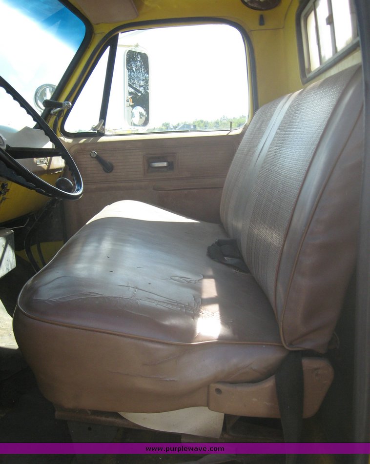 image for item 6722 1979 GMC truck with utility bed and Pitman Polecat 1500 boom arm with hydraulic driven auger and 18" bit