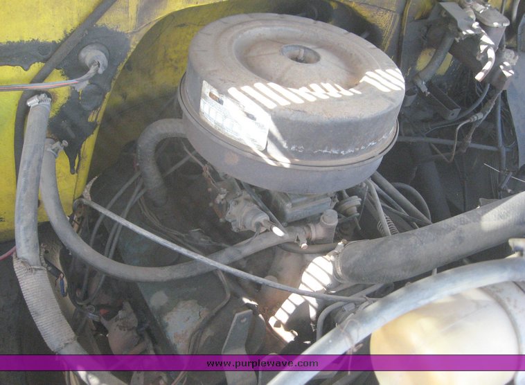 image for item 6722 1979 GMC truck with utility bed and Pitman Polecat 1500 boom arm with hydraulic driven auger and 18" bit