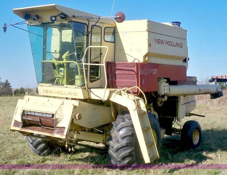 image for item 7531 New Holland TR70 combine with 20' platform with finger reel