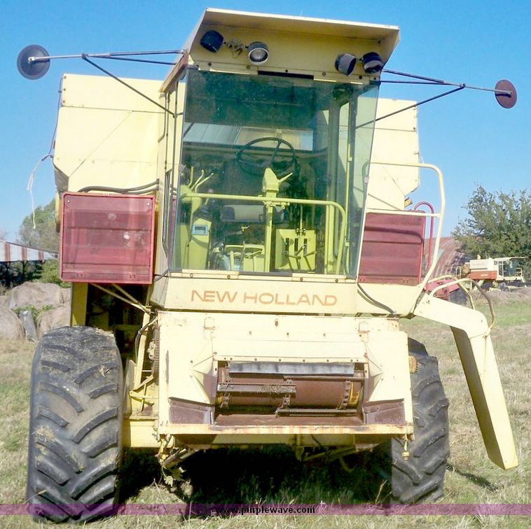 image for item 7531 New Holland TR70 combine with 20' platform with finger reel