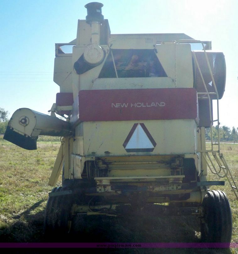 image for item 7531 New Holland TR70 combine with 20' platform with finger reel