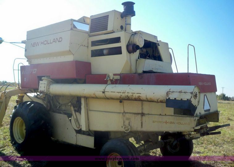 image for item 7531 New Holland TR70 combine with 20' platform with finger reel