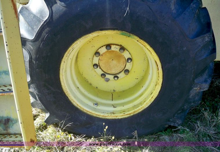 image for item 7531 New Holland TR70 combine with 20' platform with finger reel