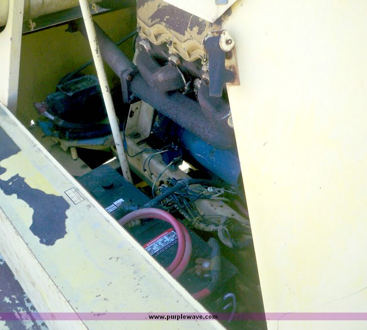 image for item 7531 New Holland TR70 combine with 20' platform with finger reel