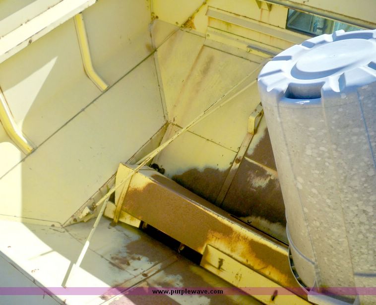 image for item 7531 New Holland TR70 combine with 20' platform with finger reel