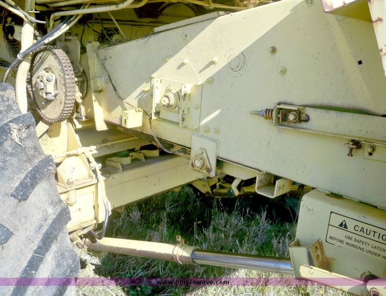 image for item 7531 New Holland TR70 combine with 20' platform with finger reel